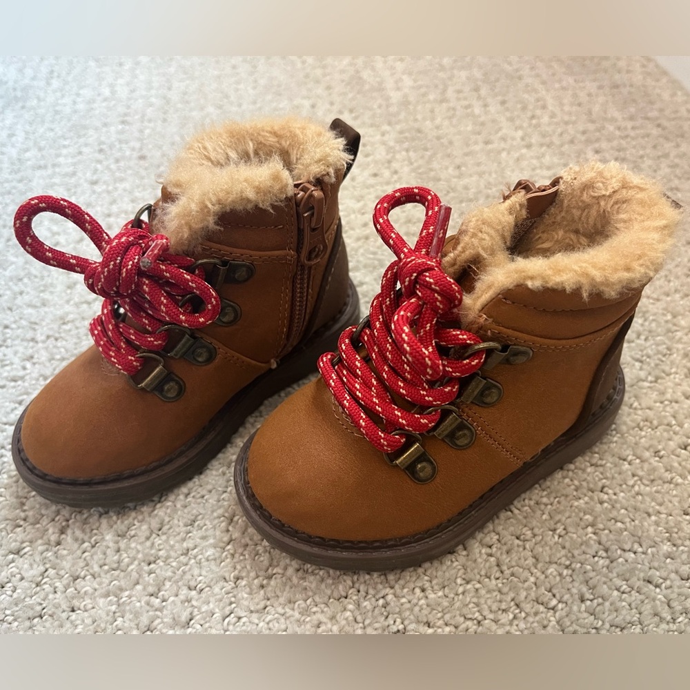 Boots with red laces and fur trim